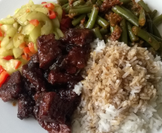 Atjar cucumber as a side dish, with white rice, sambal beans and babi ketjap