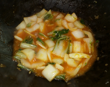 Pak Choi simmering in the sweet and sour sauce