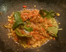 Shallots, garlic, chili peppers, laos, paprika powder, trassi and salam leaves frying